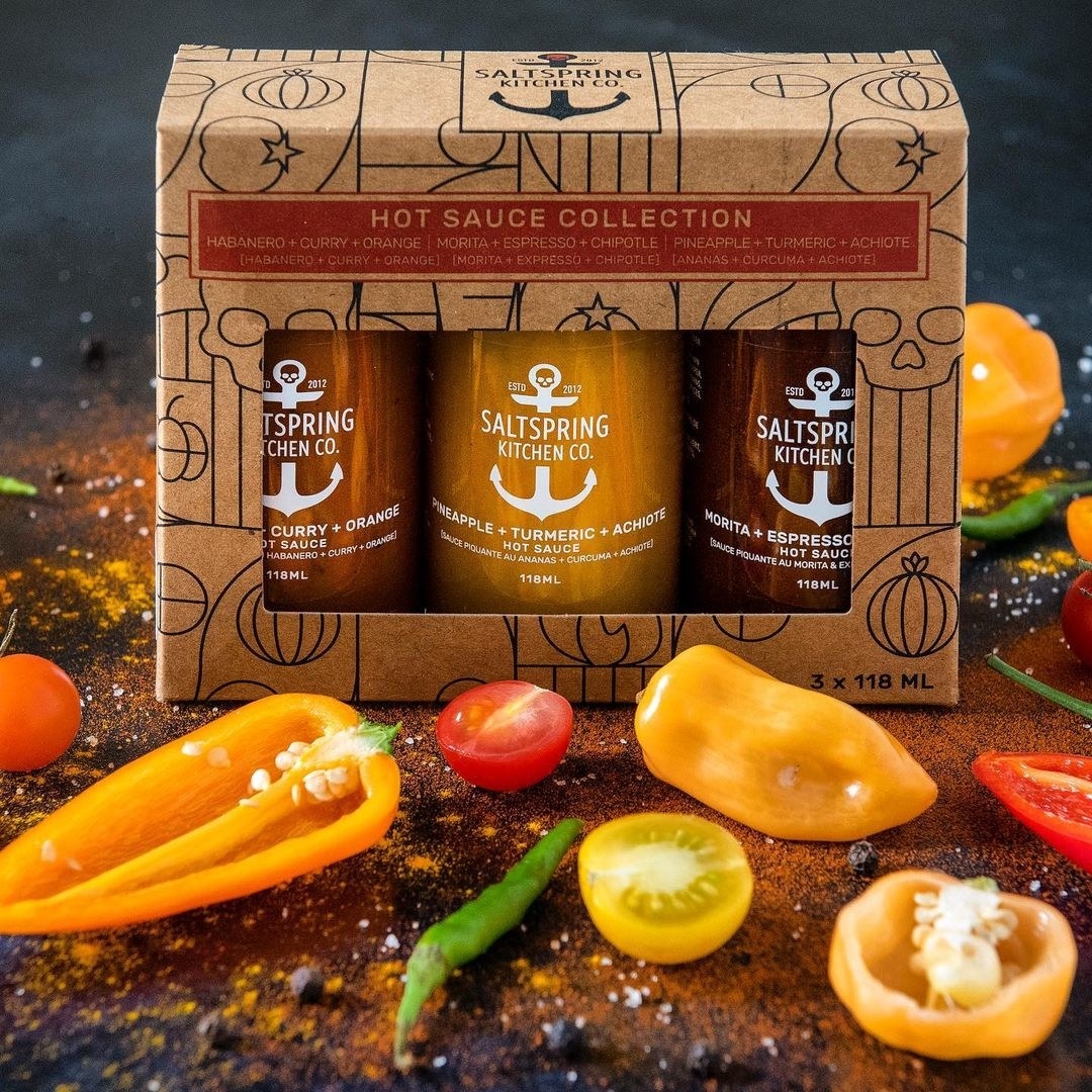 Three bottles of hot sauce in a box