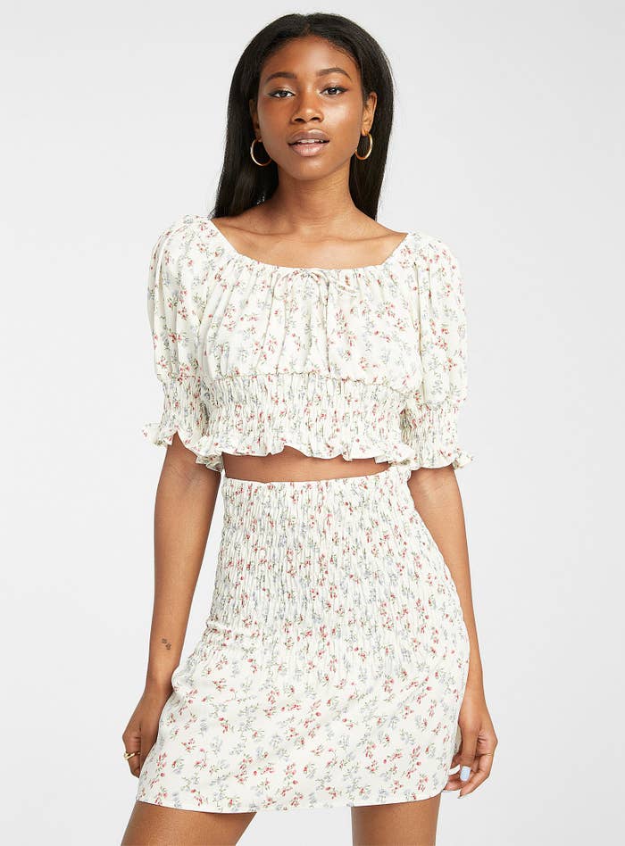 a person wearing the blouse with a matching skirt 