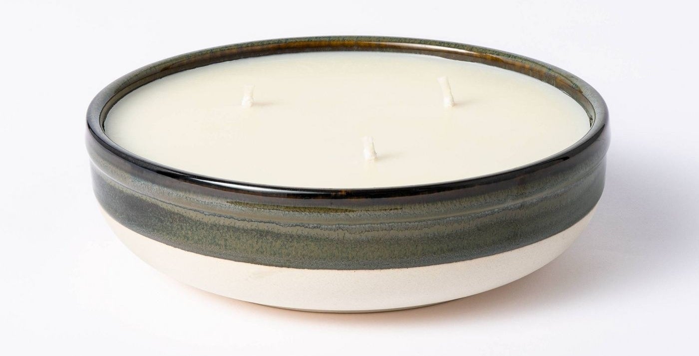 The candle in its black-and-white bowl