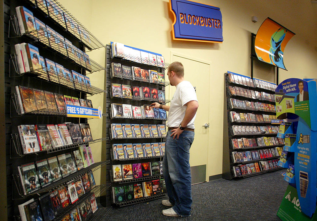 A customer picking out movies at a Blockbuster Video