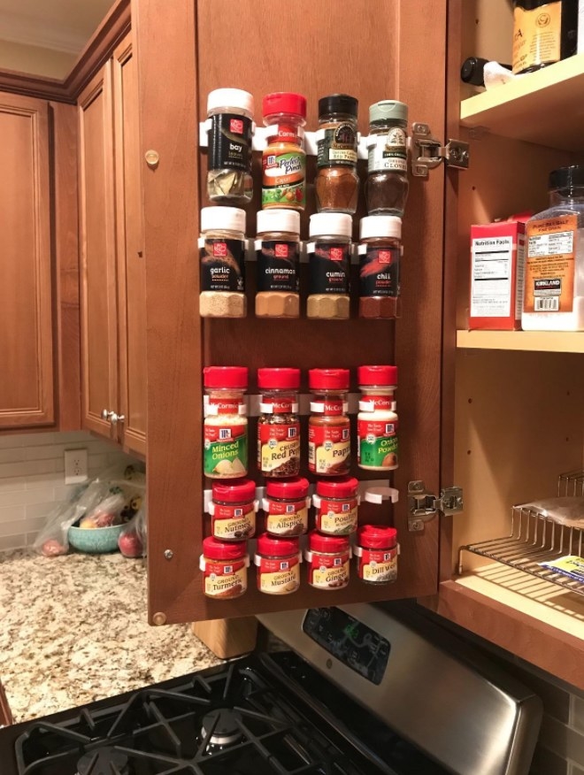 The spice clips holding up a full spice rack inside a reviewer&#x27;s cabinet 