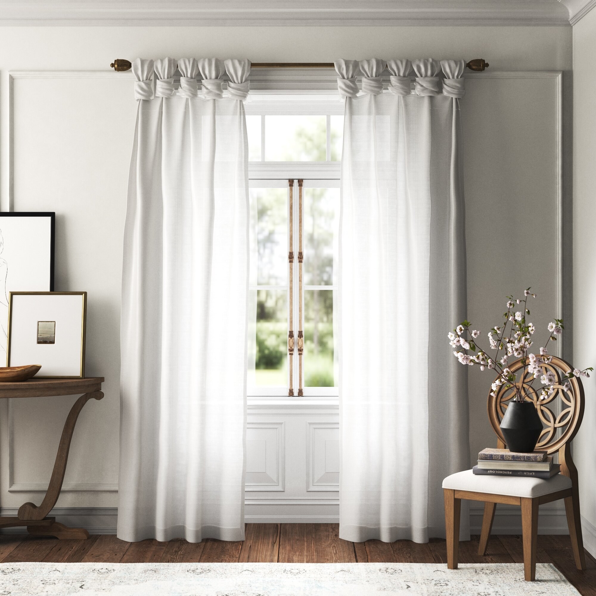 the curtains in white with knotted tops