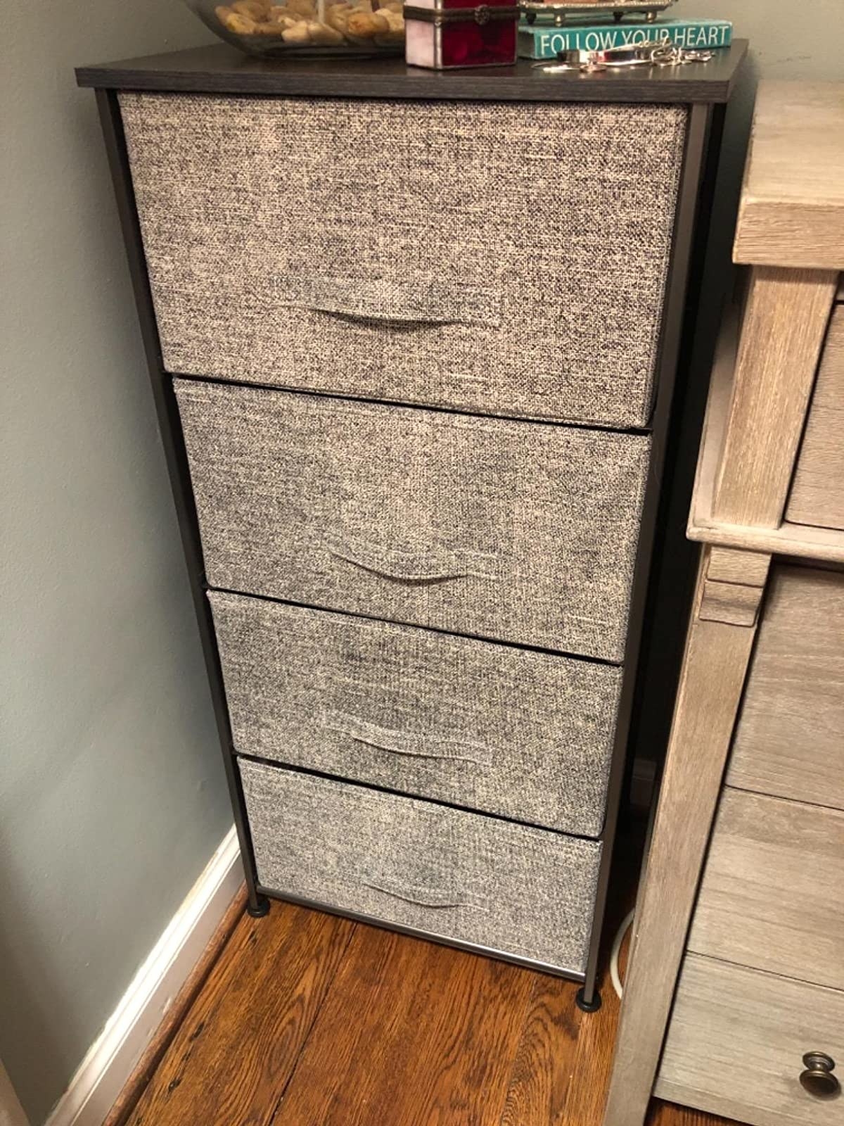 reviewer photo of a vertical dresser with wood top and grey fabric bins