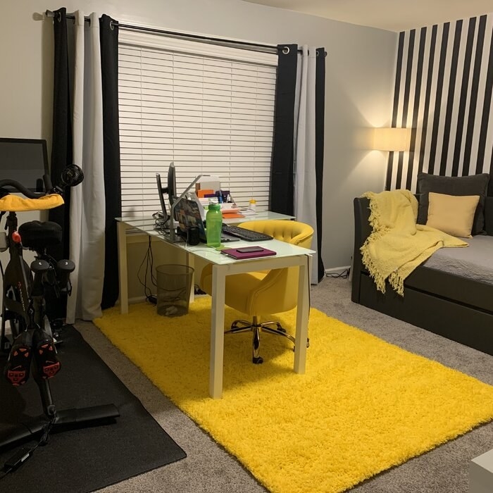 A reviewer photo of the rug in yellow