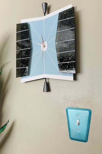 the wall plate covering a light switch in blue