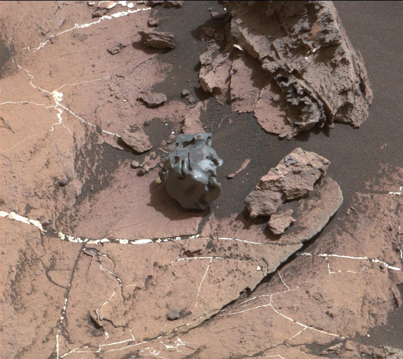 A weird rock that really stands out on the Martian ground