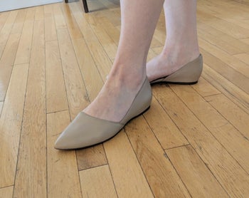 Reviewer wearing the beige pointed flats