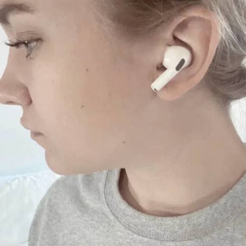 Side view of a BuzzFeed editor wearing the airpods