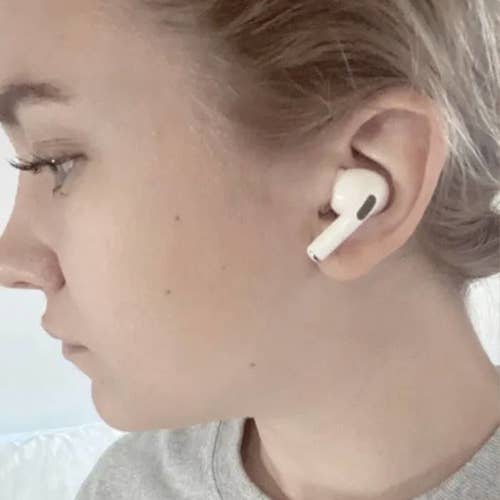 Side view of a BuzzFeed editor wearing the airpods