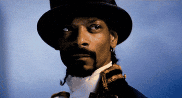 Snoop Dogg in a top hat nods his head