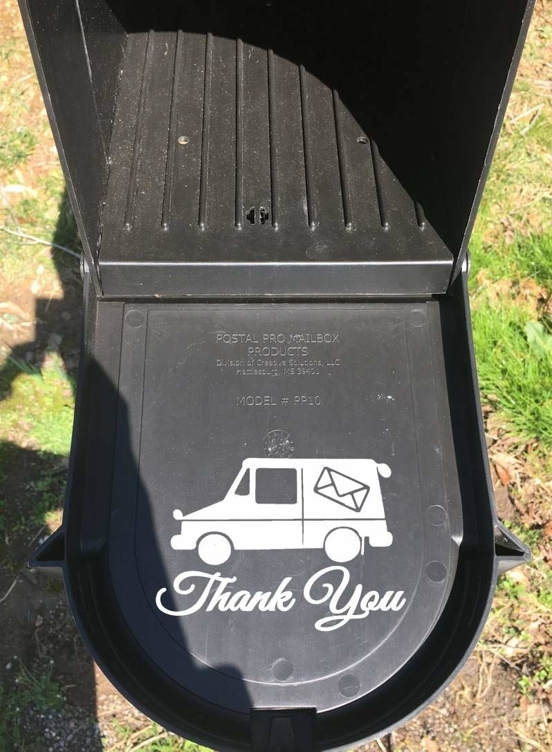 a mailbox opened to show a white mail truck decal inside and the words &quot;thank you&quot;