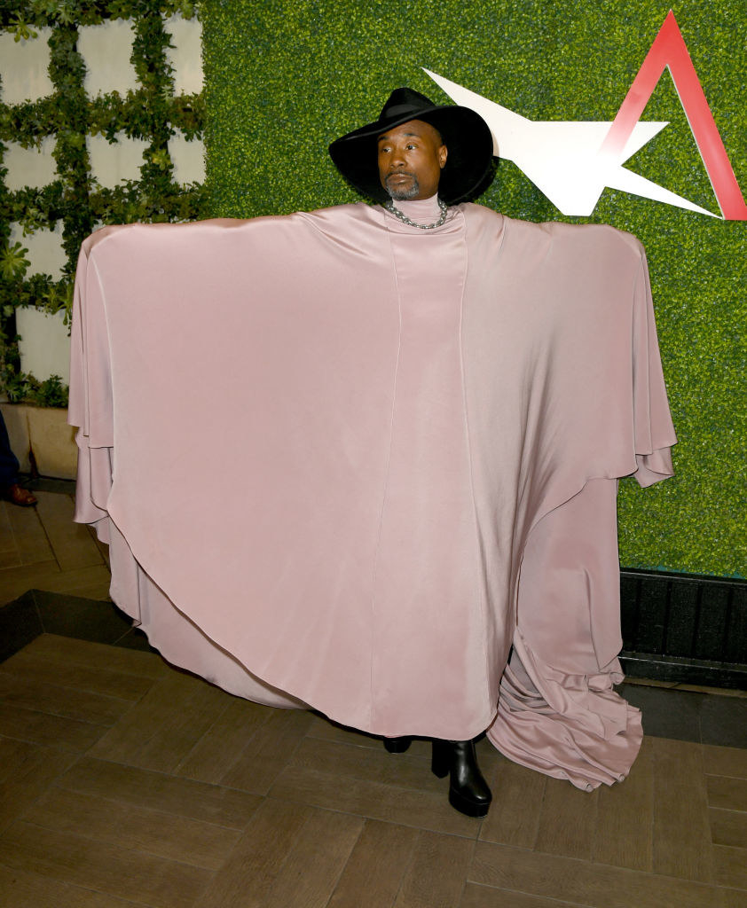 Billy Porter in a large, pale pink cape and dress