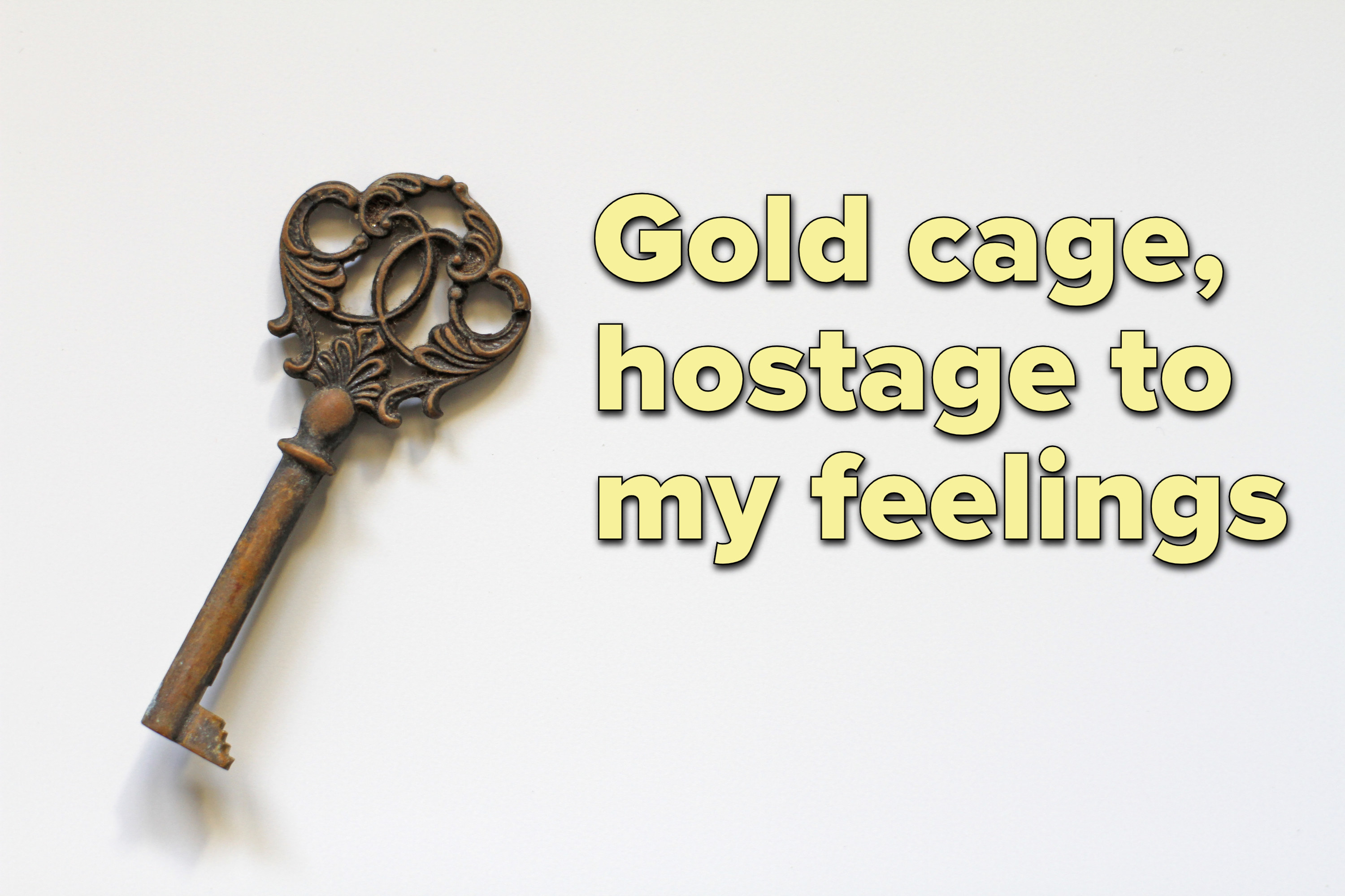 Photo of a brass key with lyrics from &quot;So It Goes...&quot; by Taylor Swift in text