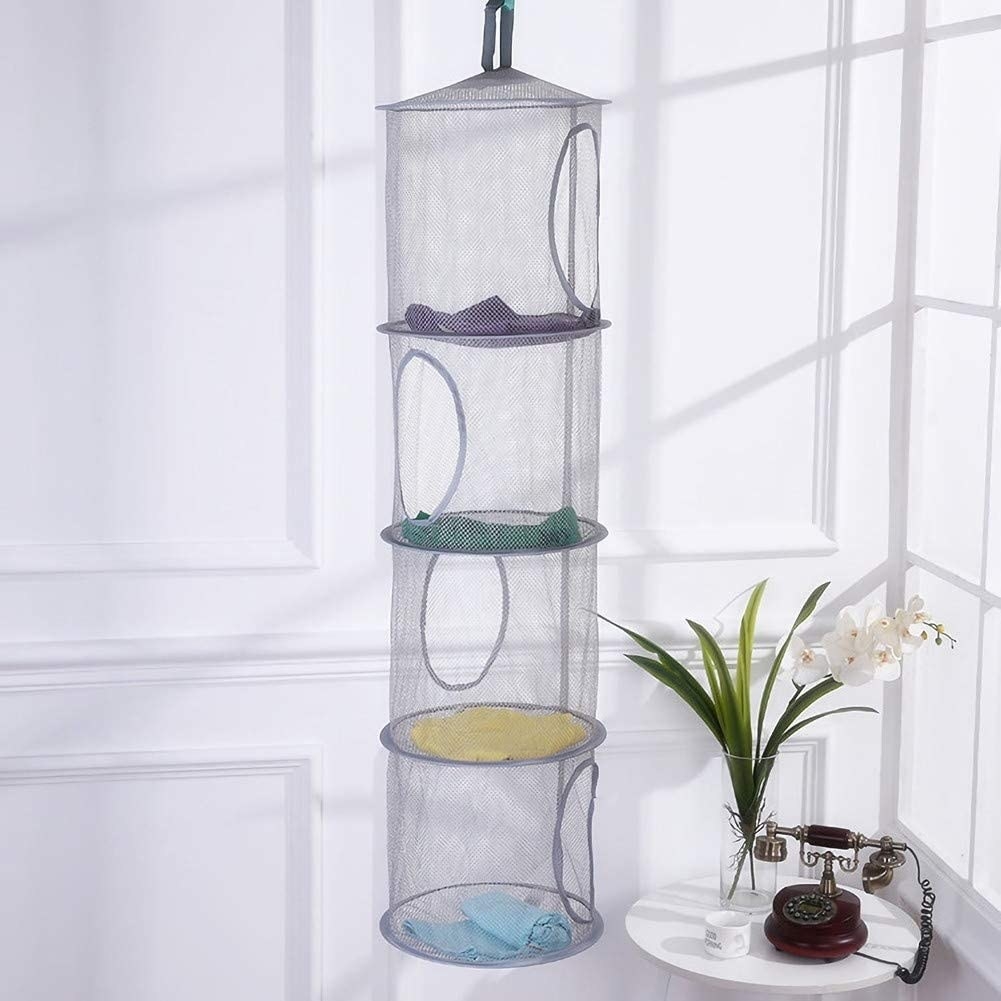 The five-tier mesh organizer in gray hanging from a ceiling 