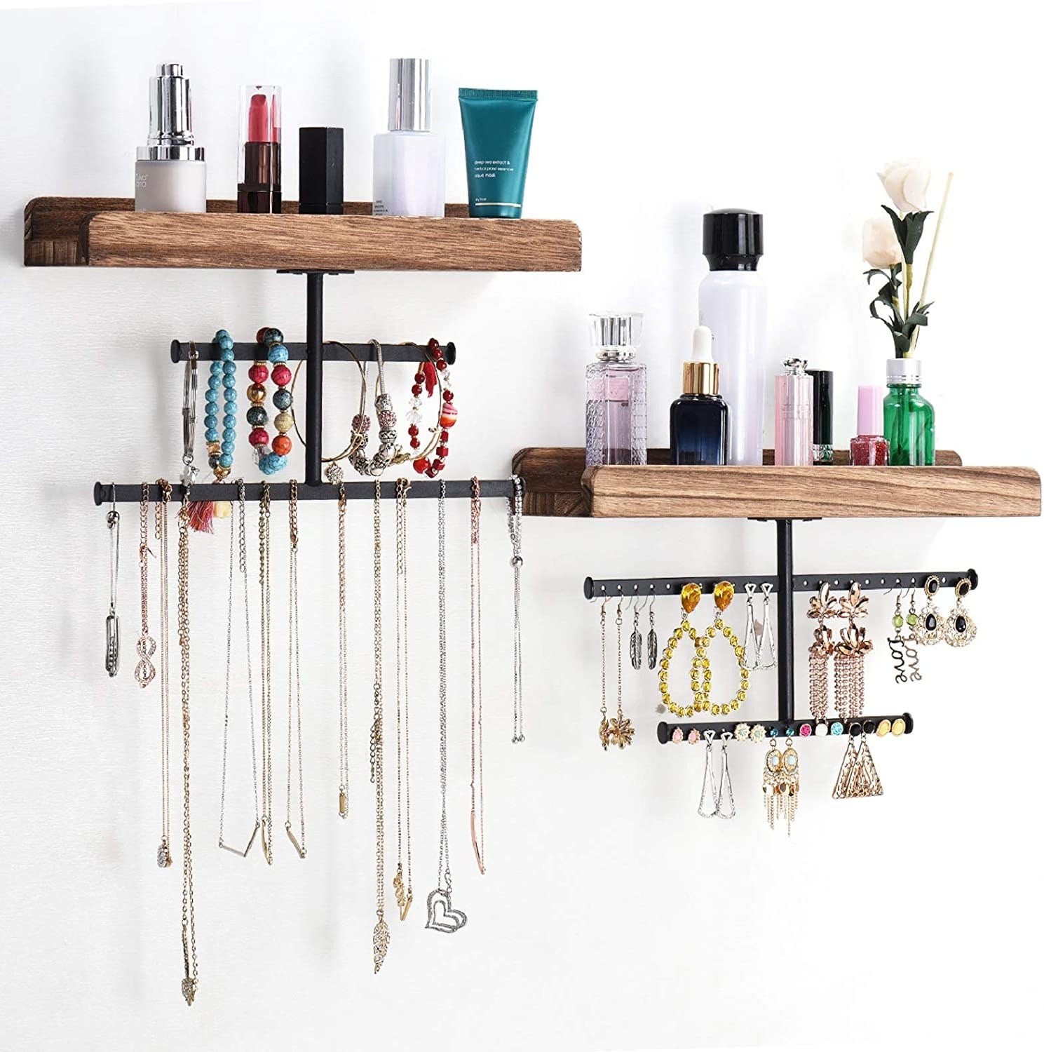 The shelves installed on a wall with jewelry hanging from the hooks