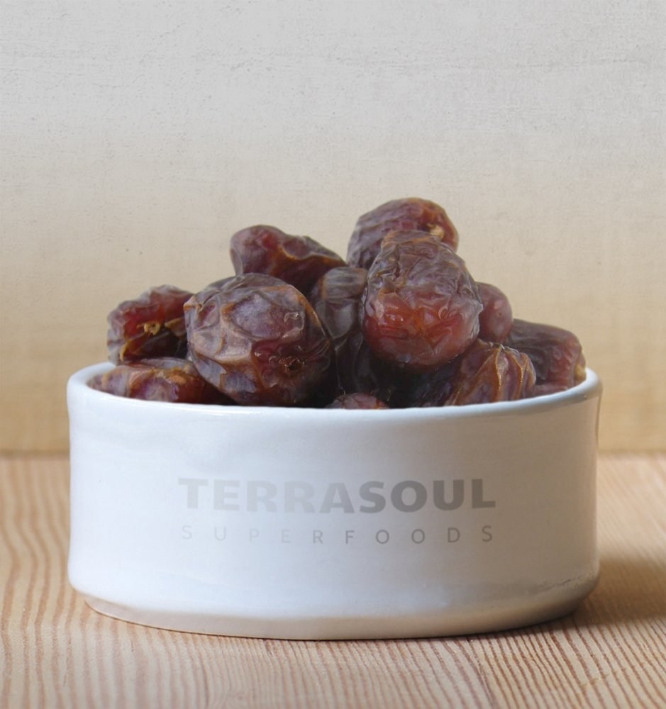 Dates presented in a white bowl