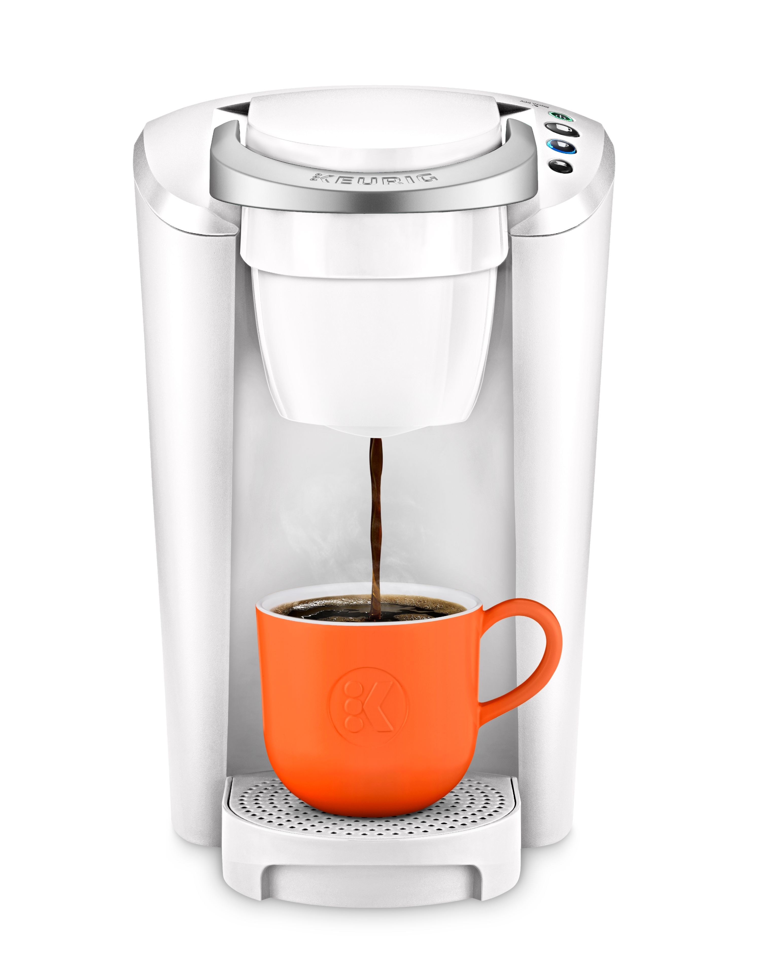 The coffee maker in white, with an orange cup in it, dispensing coffee