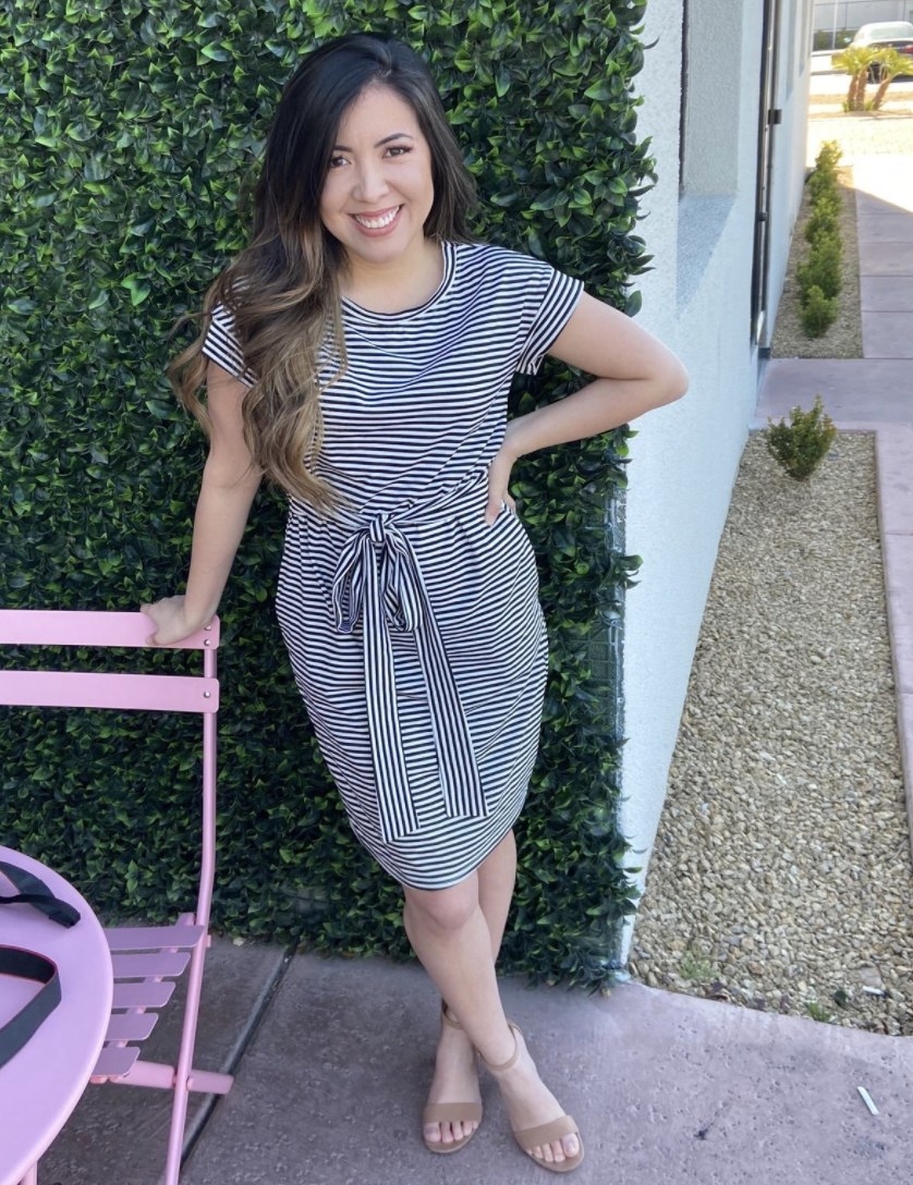 A person wearing a white and black striped dress