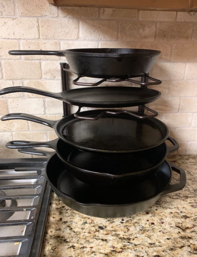 A reviewer&#x27;s pans stacked up on the rack 