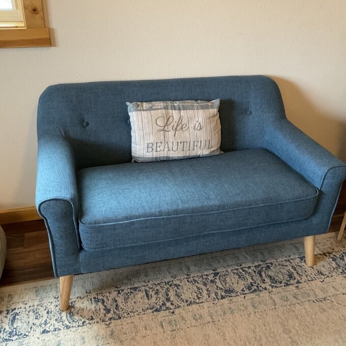 A reviewer photo of the loveseat in blue