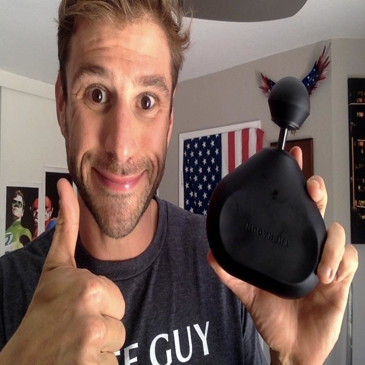 Reviewer holding the massager