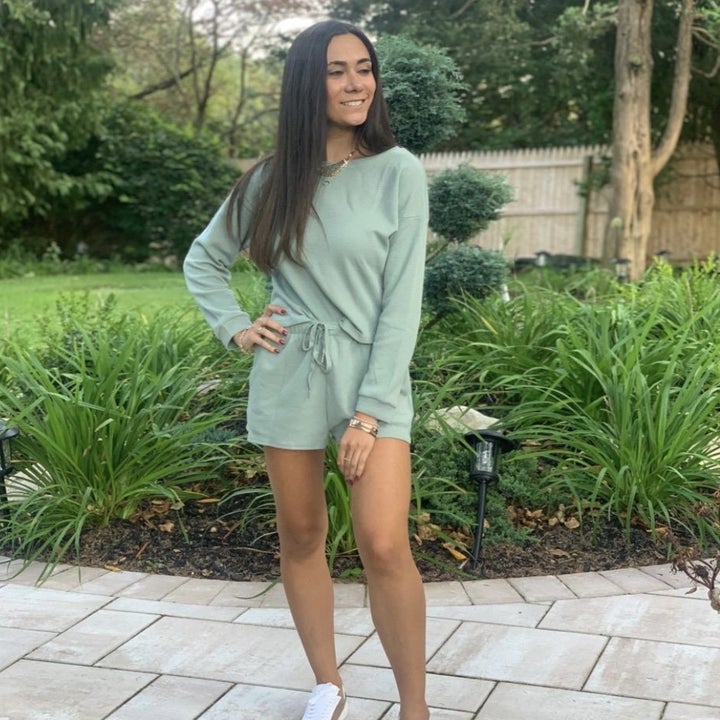 Person wearing it in the green version 