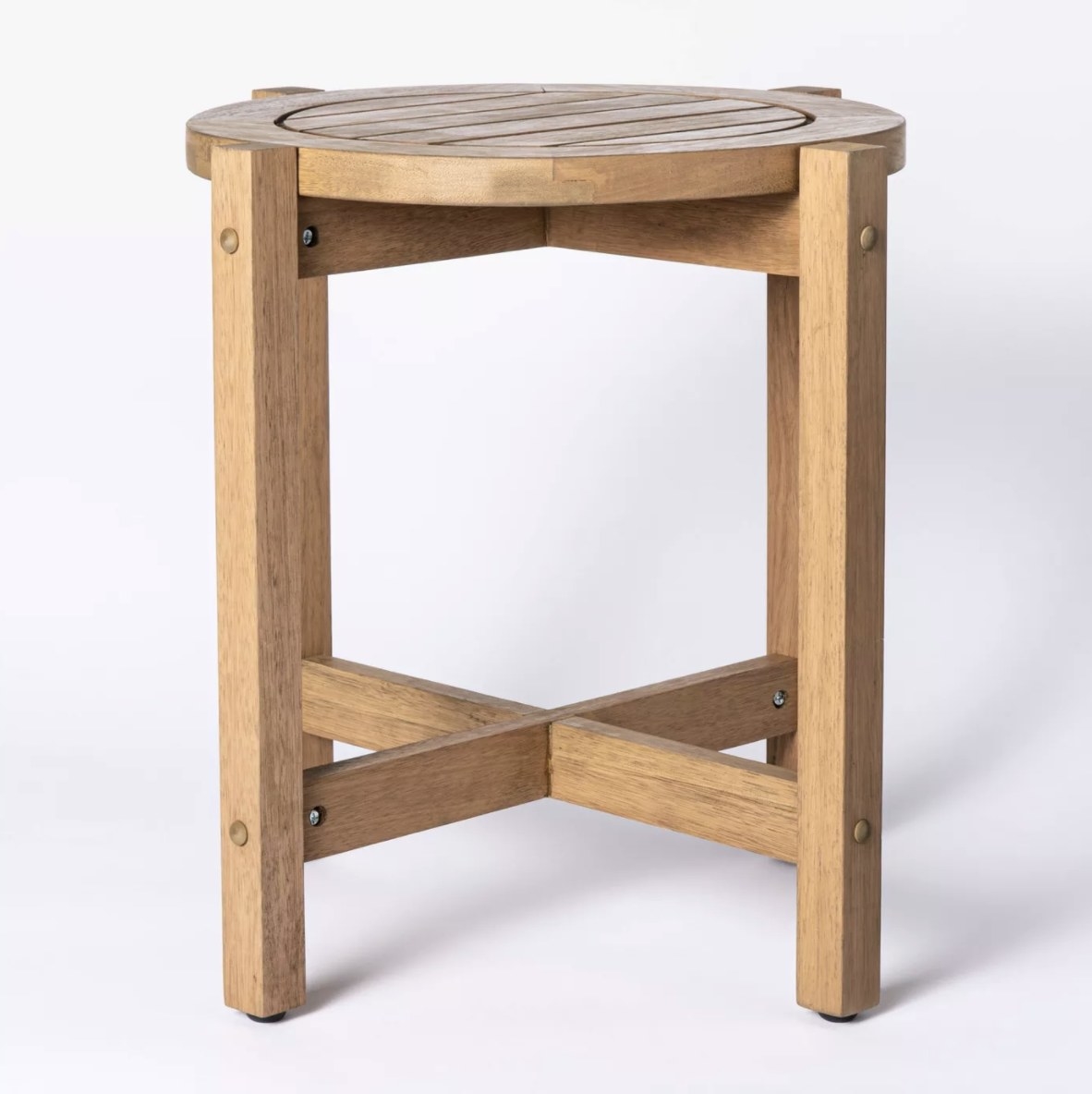 The wooden table has an X-frame at the bottom and a slatted circular top