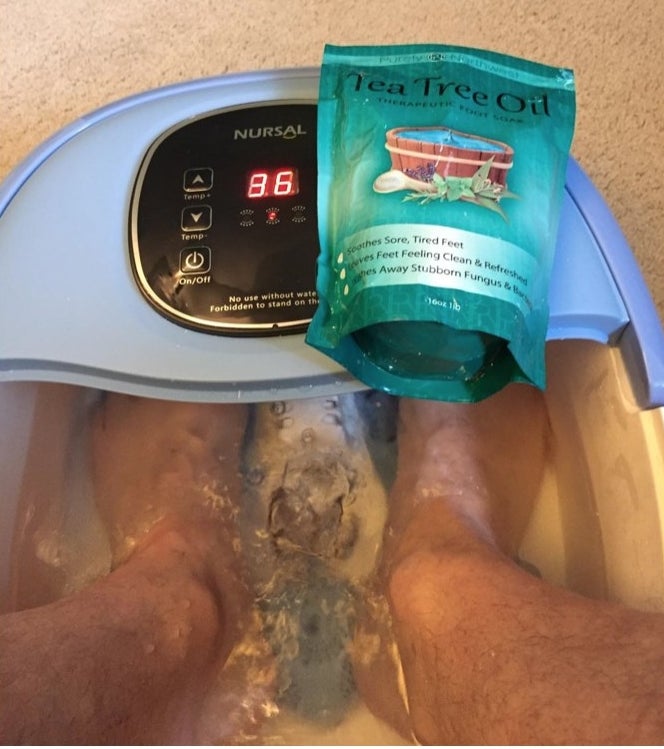 reviewer soaking their feet in a spa with the soak