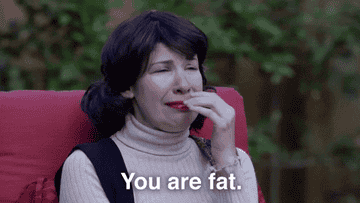 A woman crying and saying, &quot;You are fat.&quot;