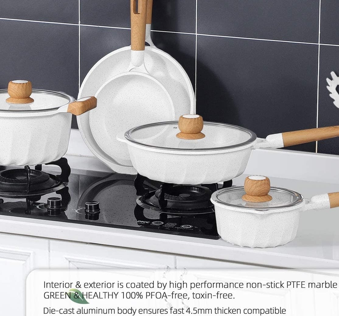 A full set of pots and pans on a stovetop