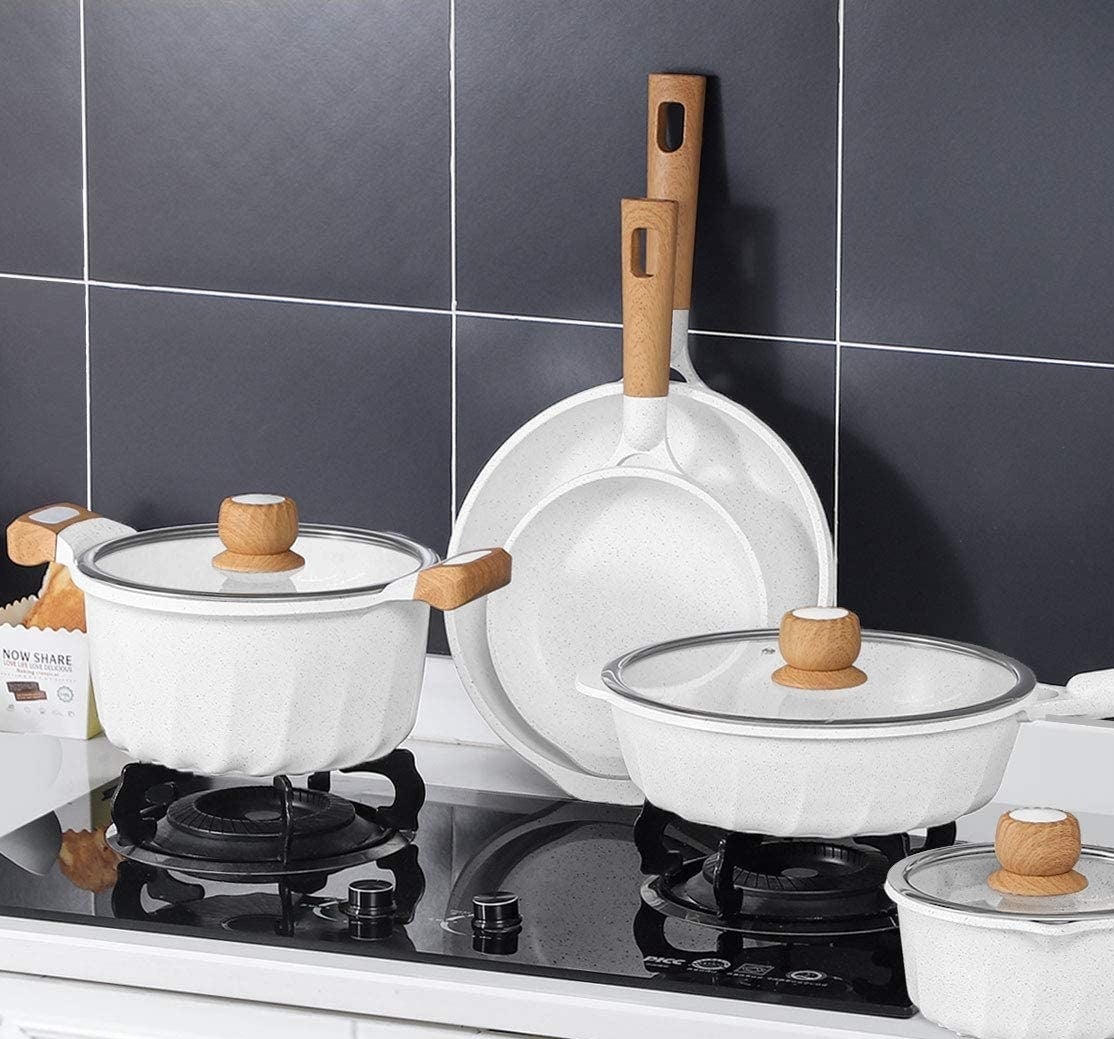A full set of pots and pans on a stovetop