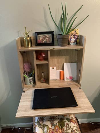 Reviewer's unfolded laptop desk and storage