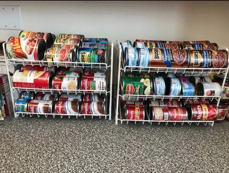 A white can organizer, full of colorful cans 