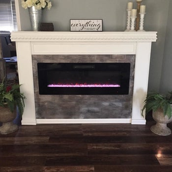 reviewer's electric fireplace installed in a mantel 