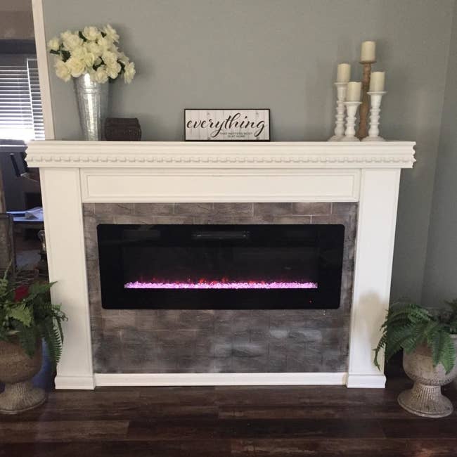 reviewer's electric fireplace installed in a mantel 
