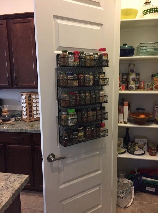 A over the wall spice rack, filled with colorful spices