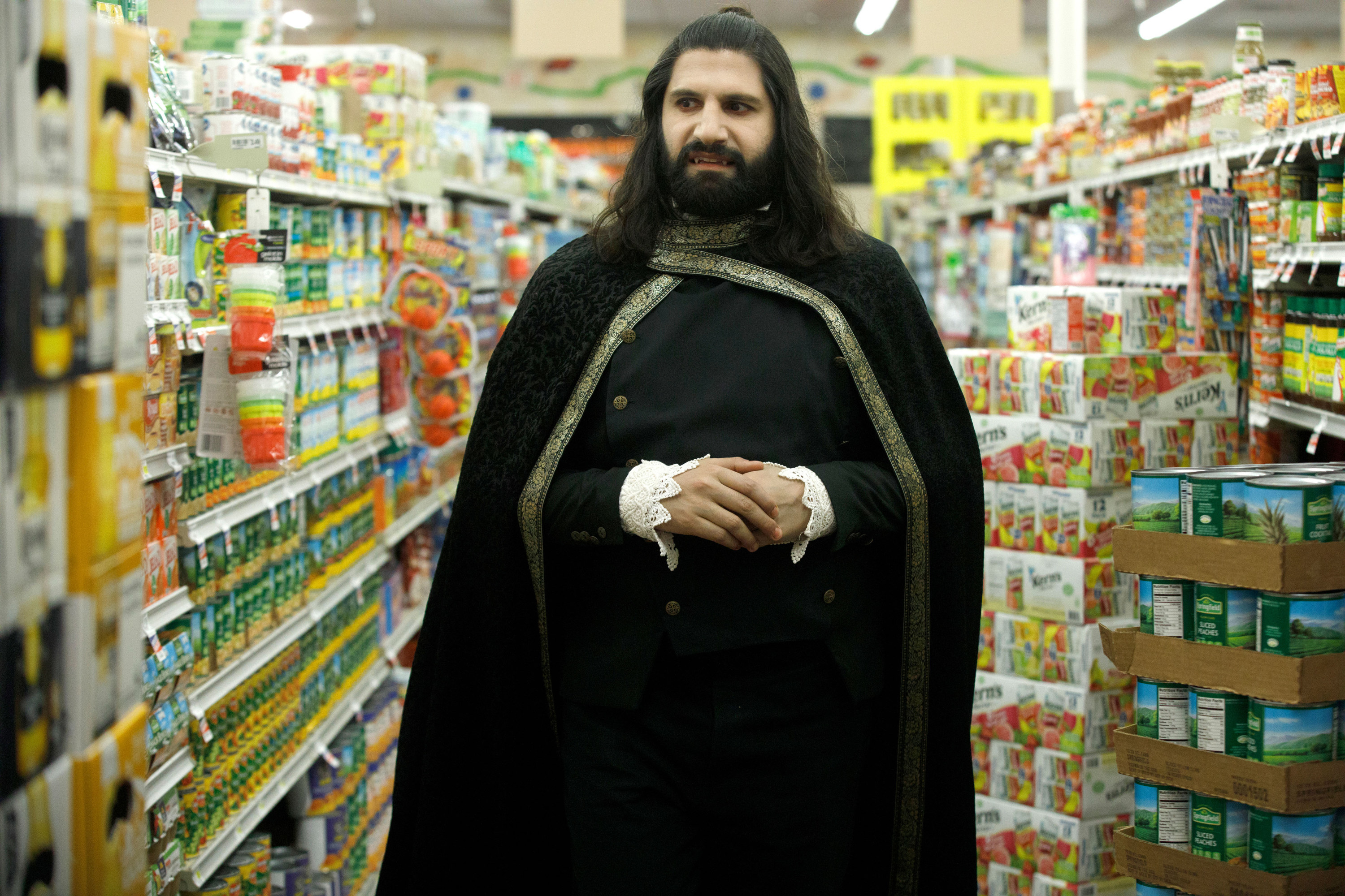 Nandor walking through a grocery store