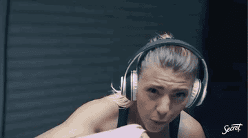 GIF of a woman boxing and another woman staring at the camera.