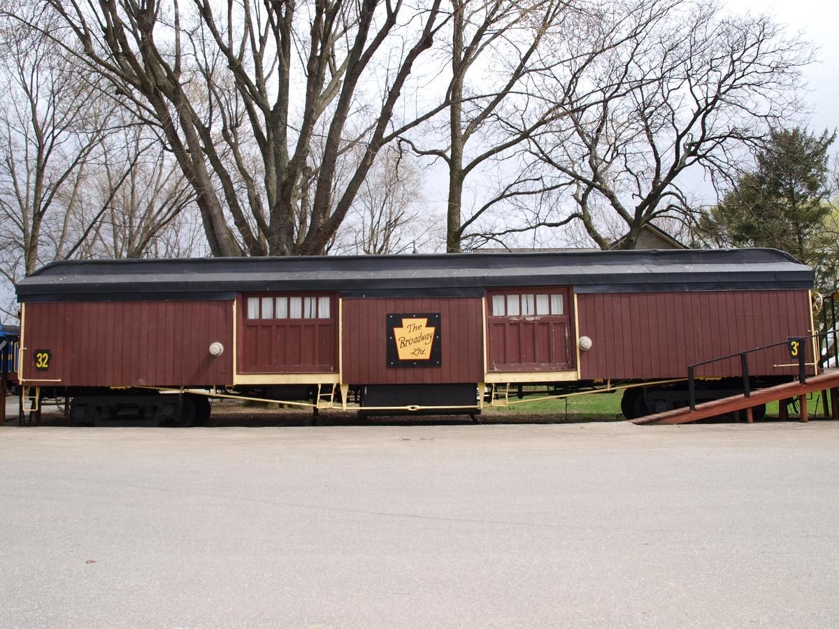 Exterior of an old-fashioned train carriage converted into a motel suite 