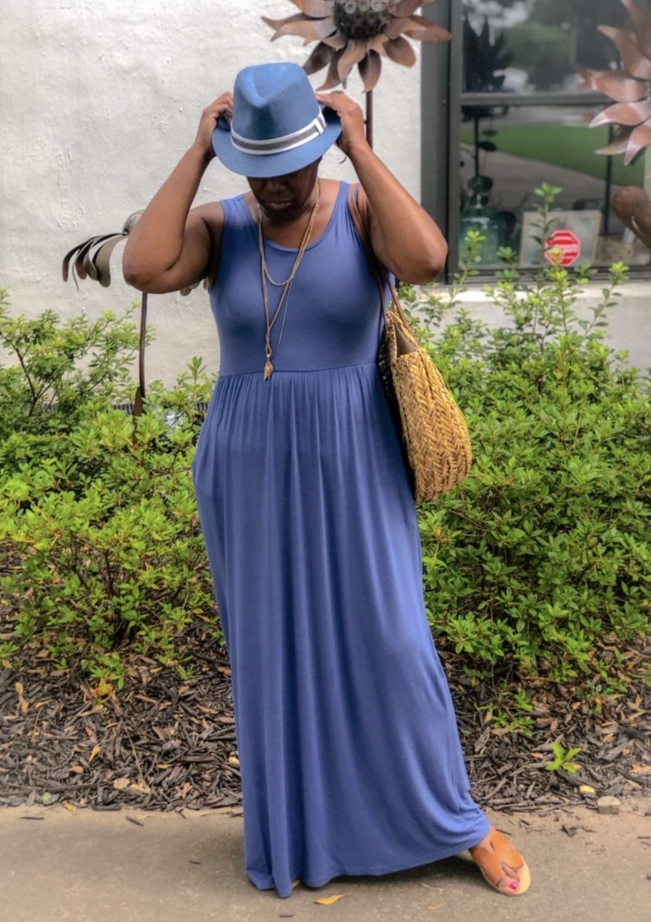 reviewer wearing a blue maxi dress with sandals