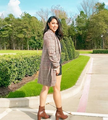 Reviewer wearing the brown plaid coat