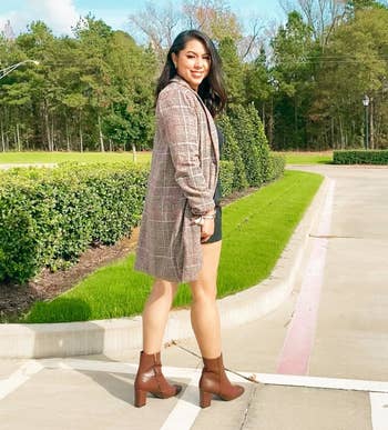 Reviewer wearing the brown plaid coat