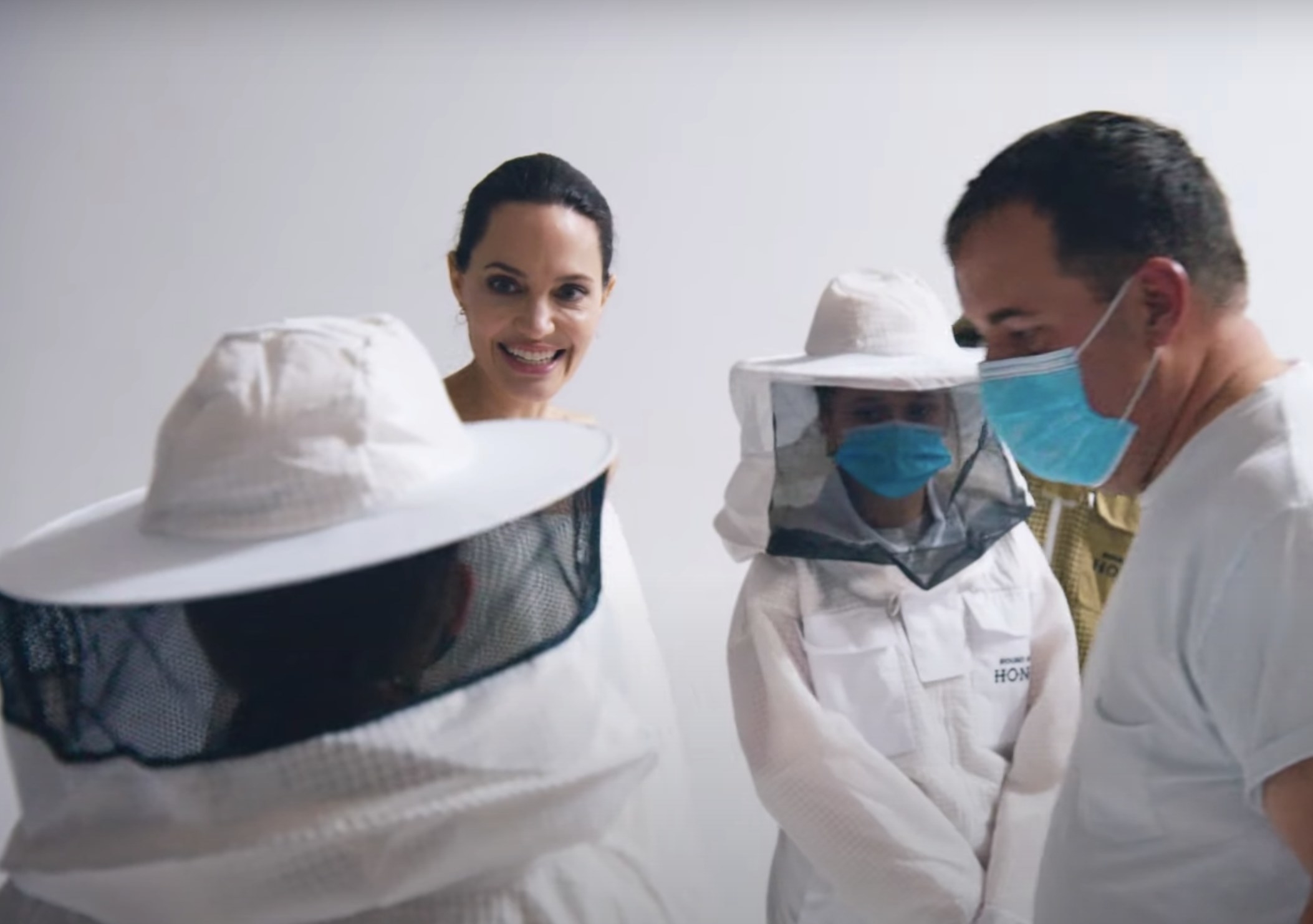 Angelina smiles at the beekeepers on set