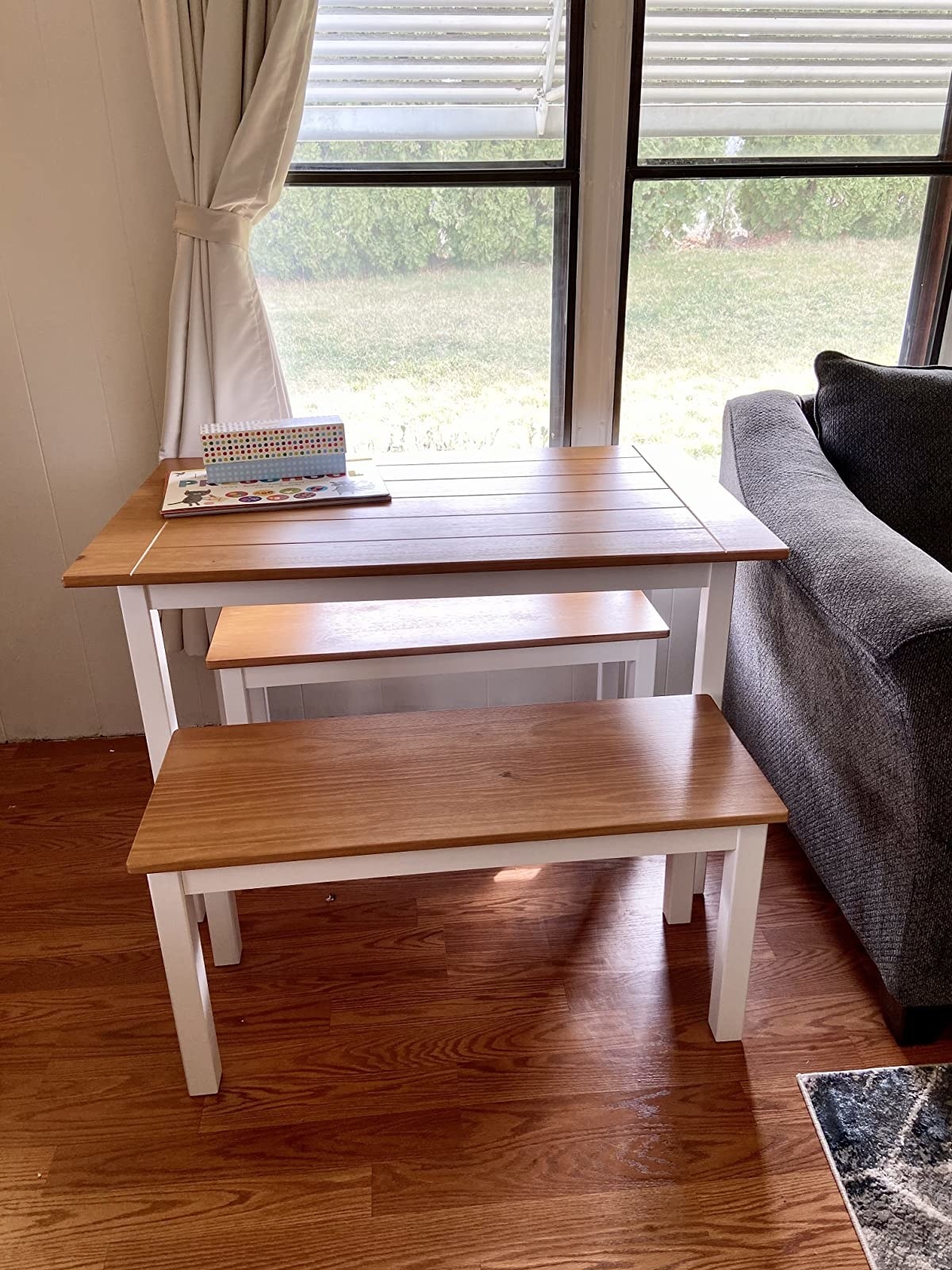 reviewer image of wood table with white legs and two matching benches