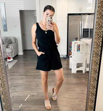 reviewer wearing black romper