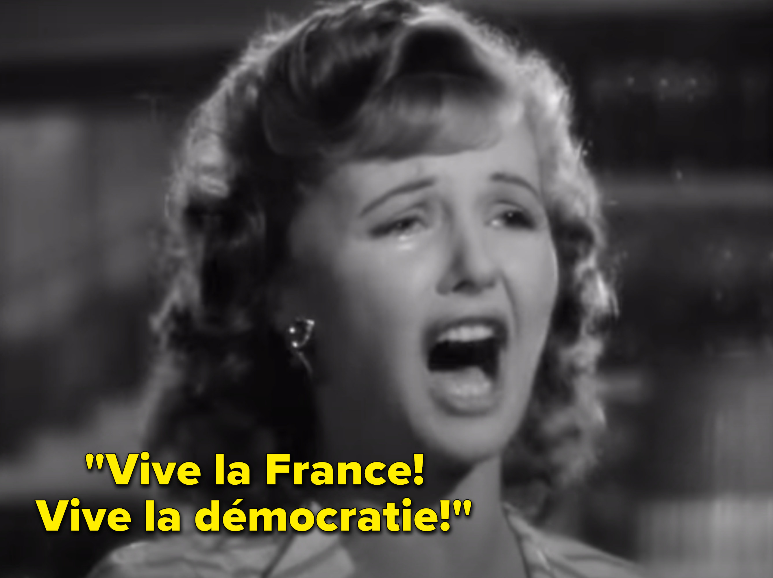 Crying woman singing, &quot;Vive la France! Vive la démocratie!&quot;