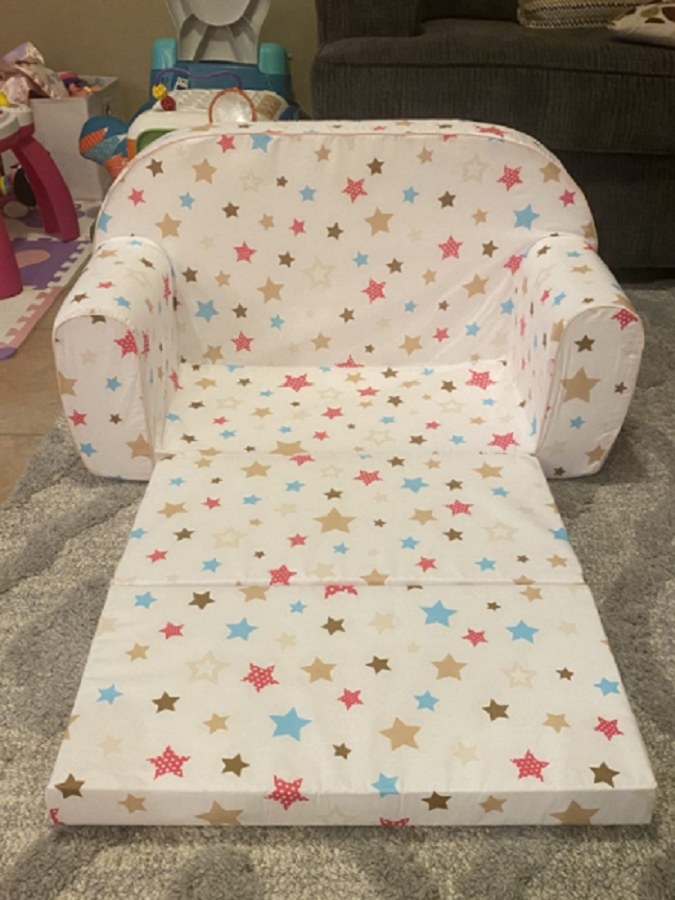 A cotton children’s couch inside a playroom