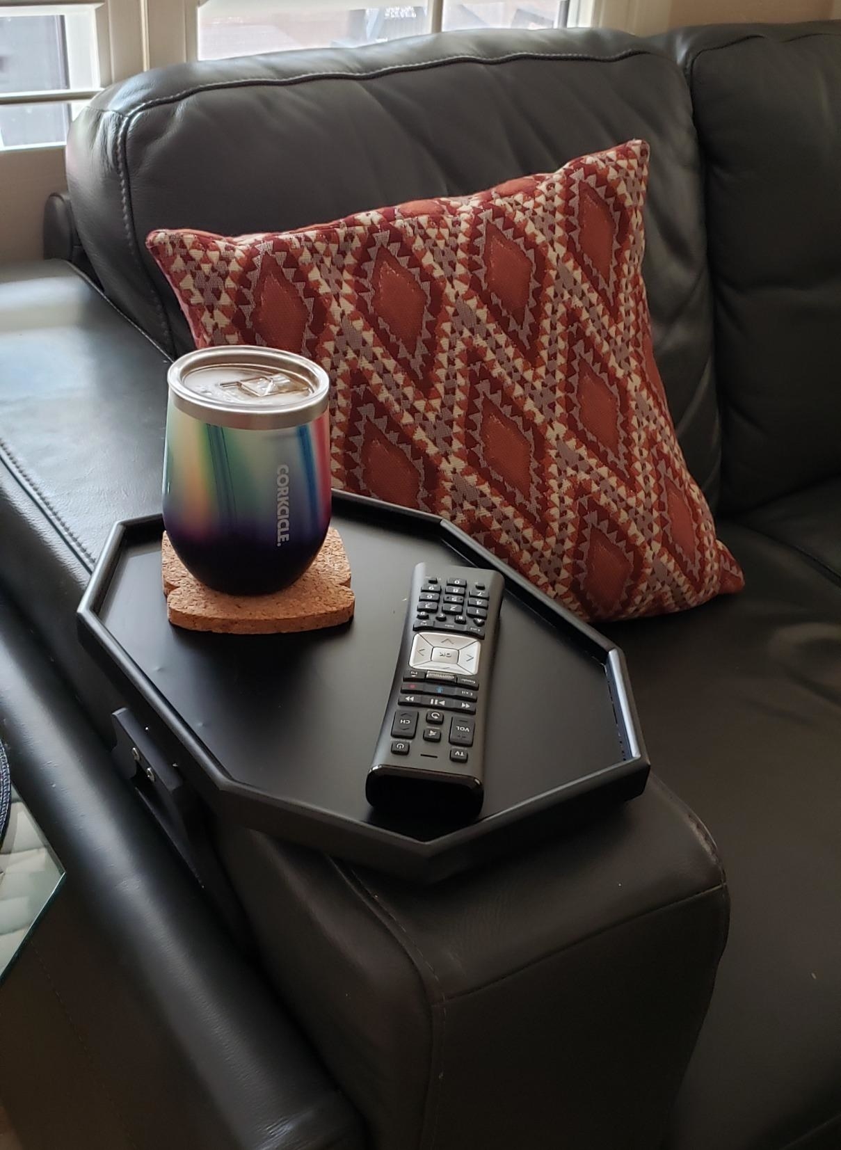 Reviewer  sofa arm table on couch with cup and remote on top