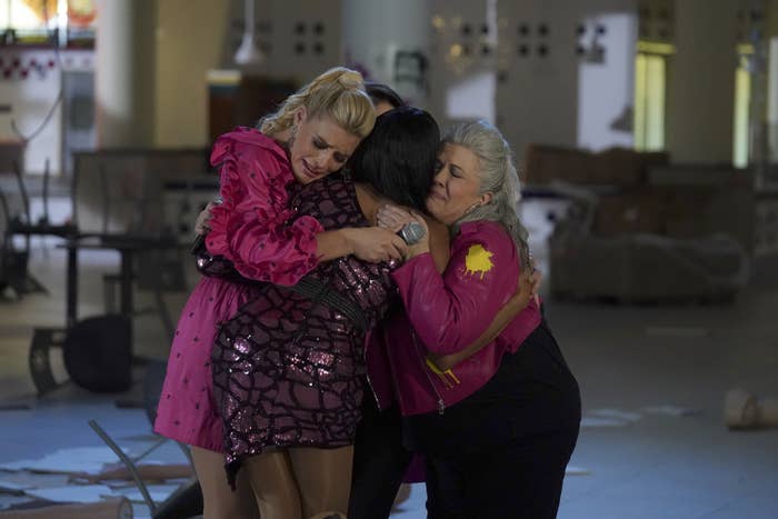 The girl group, including Busy Philipps and Paula Pell, embrace