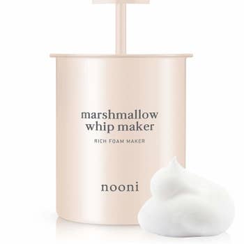 Marshmallow whip maker bottle placed next to foam 